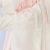 Flowing soft pink and white fabric of The Ivory Lady Elizabeth Bolero Jacket