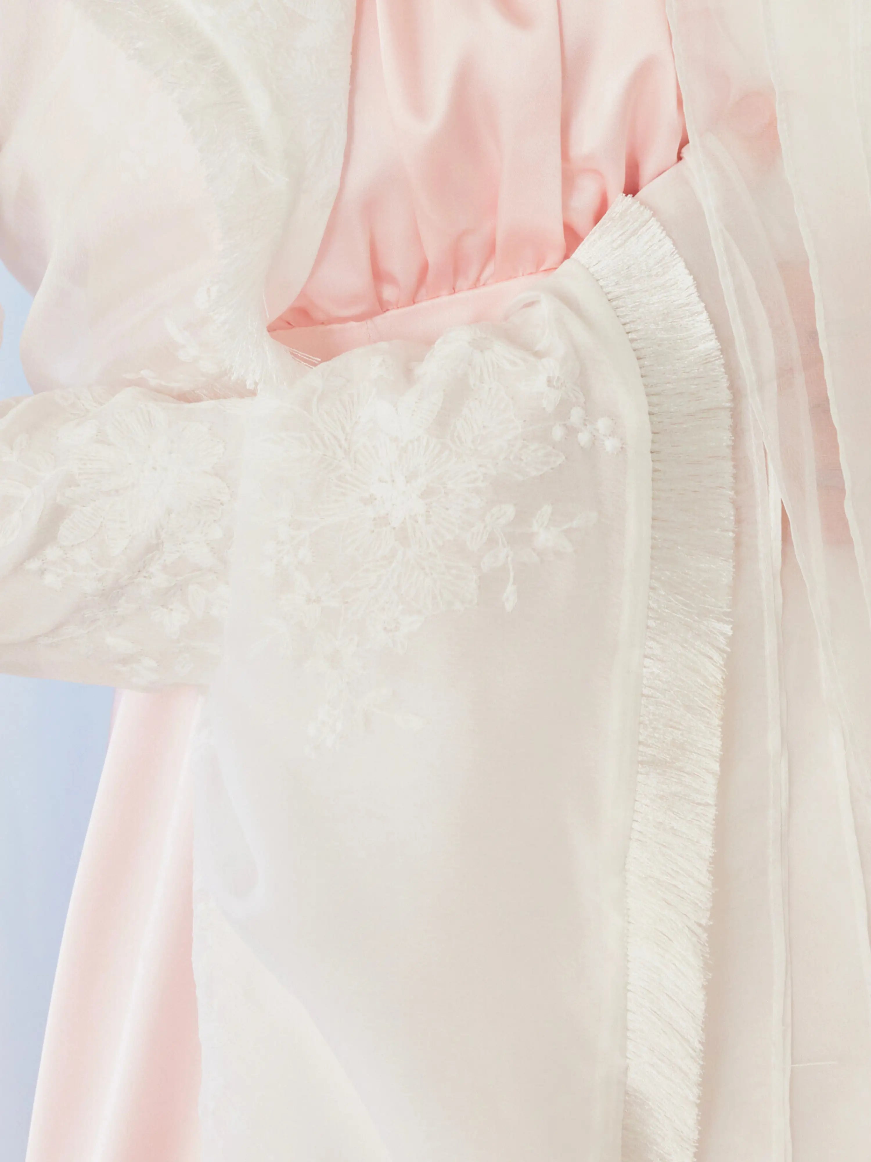 Flowing soft pink and white fabric of The Ivory Lady Elizabeth Bolero Jacket