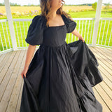 Black Josephine Gown featuring classic puff sleeves and a meticulously structured full skirt