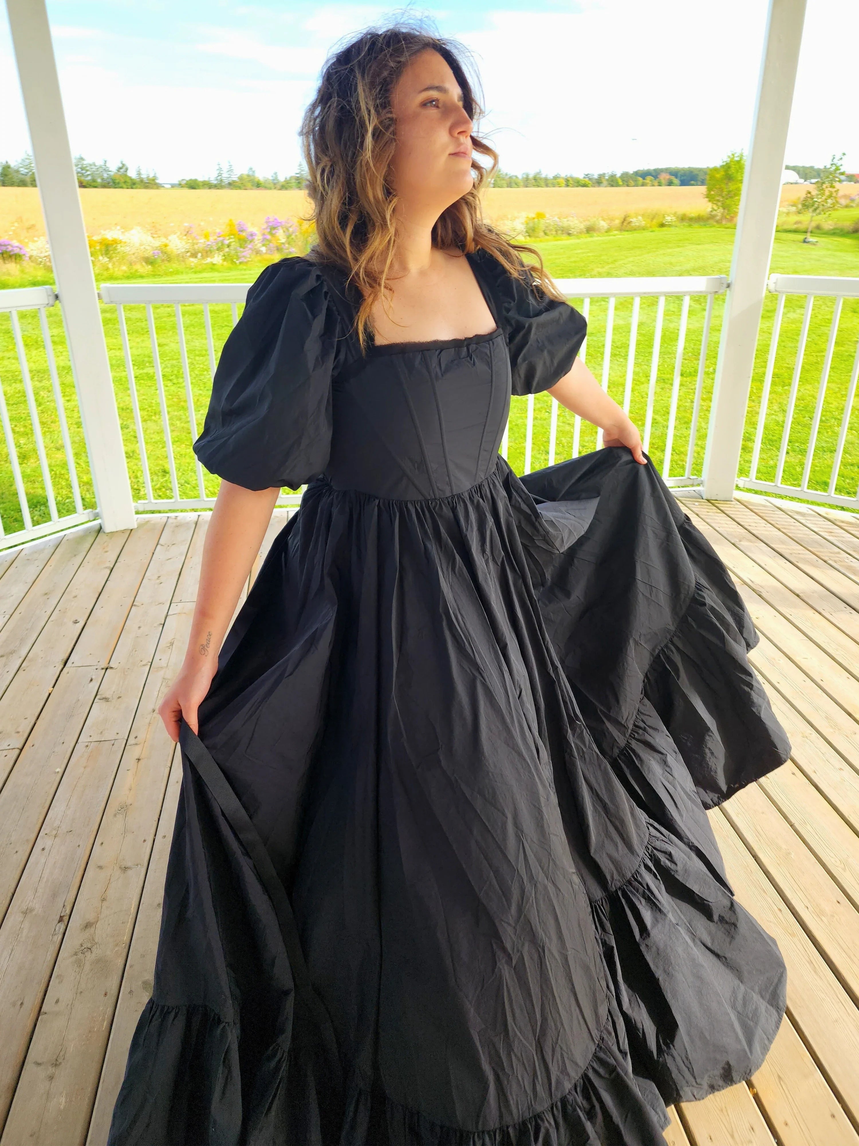 Black Josephine Gown featuring classic puff sleeves and a meticulously structured full skirt