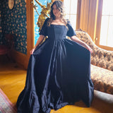 Navy blue Josephine Gown with classic puff sleeves and a meticulously structured bodice