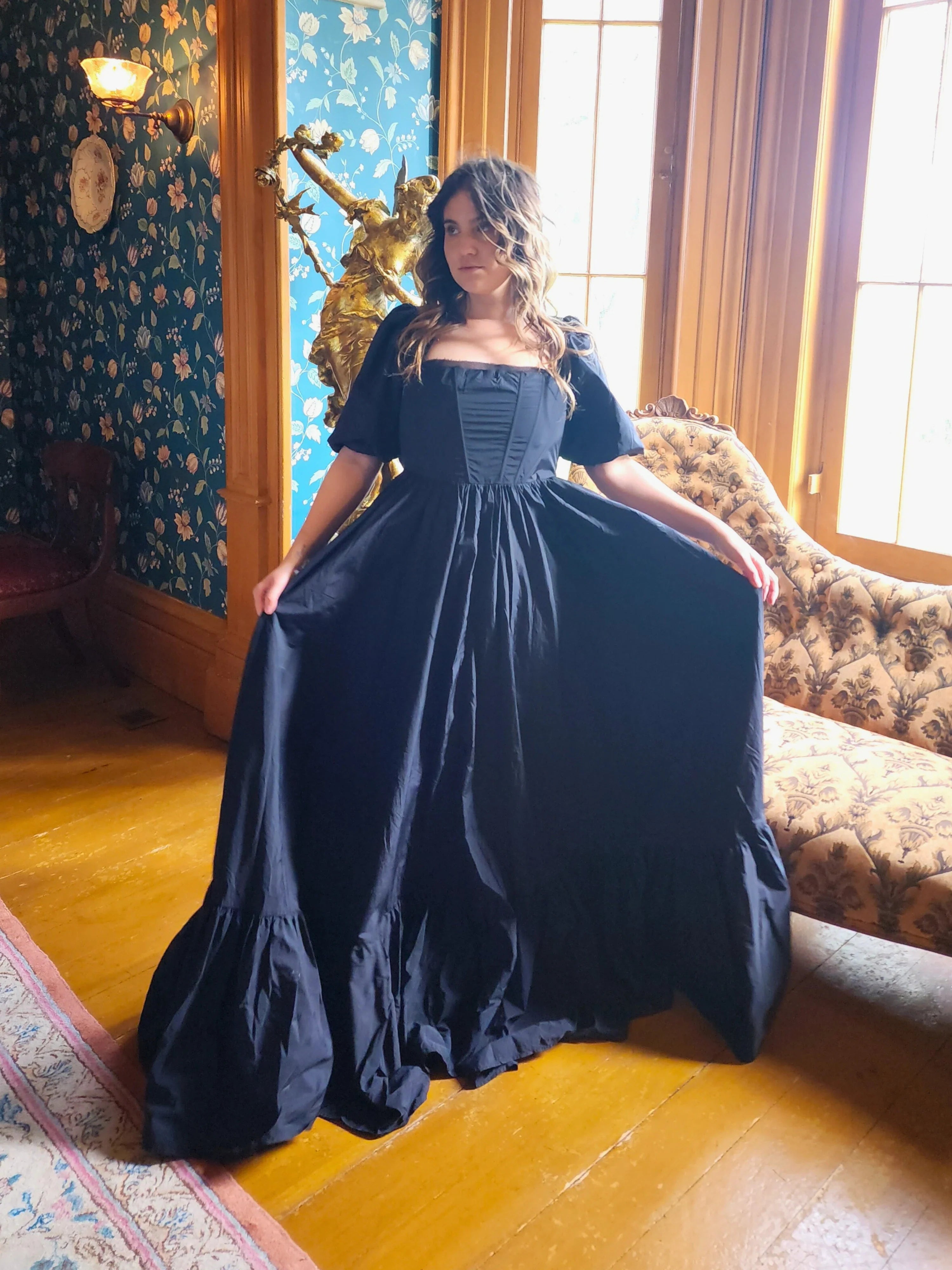 Navy blue Josephine Gown with classic puff sleeves and a meticulously structured bodice