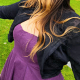 Purple dress layered with a black jacket from the Lady Elizabeth collection