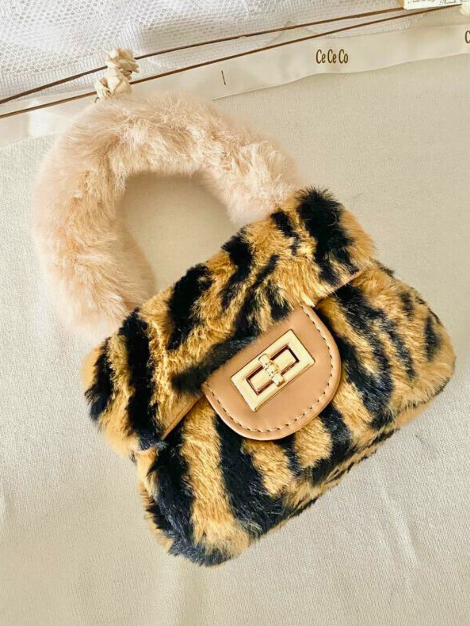 Fluffy Leopard Faux Fur Micro Handbag with tiger-like print and pink furry handle