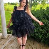 Ruffled off-shoulder black feather mini dress with tiered layers for stylish elegance