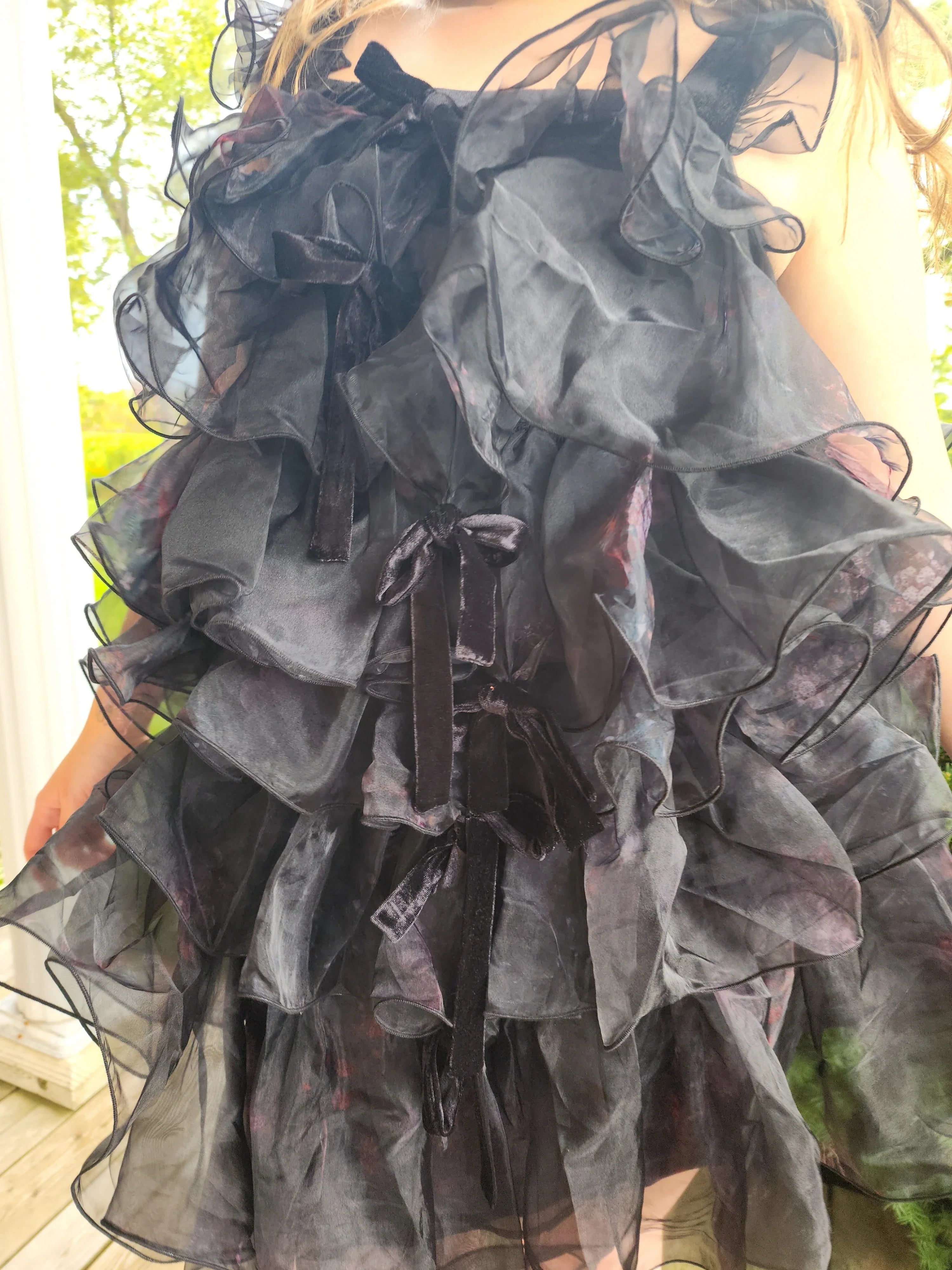 Ruffled layered gray feather mini dress with sheer fabric and voluminous skirt