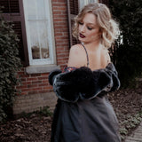Back view of a woman in the Stained Rose Lilith Coat standing in front of a brick building.