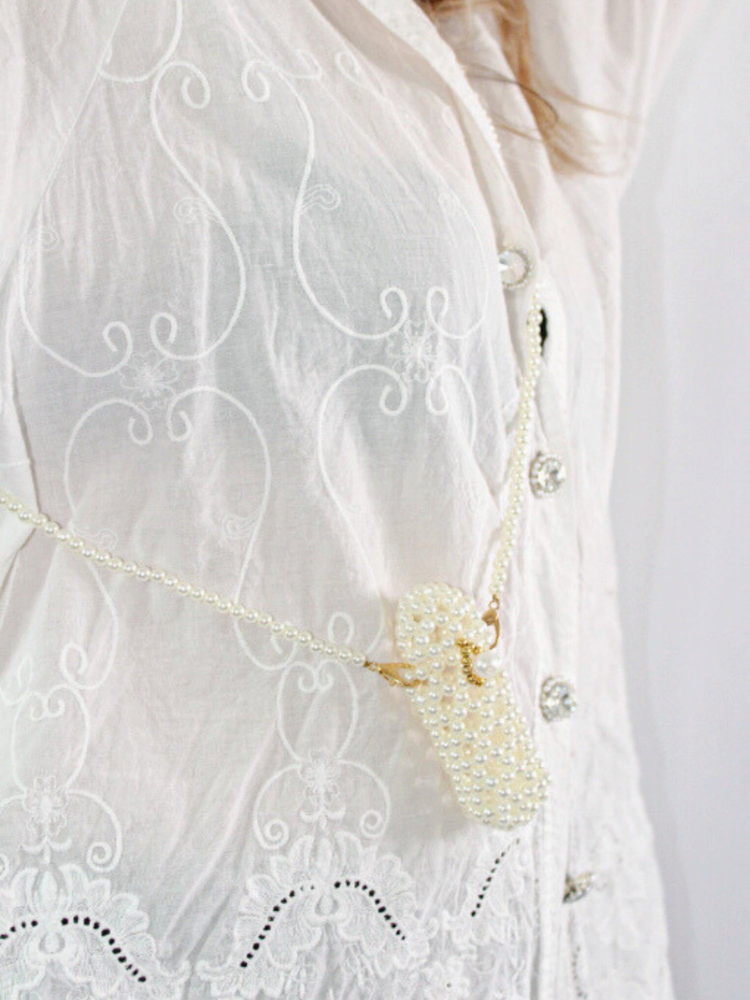 Delicate white blouse with embroidery and pearl purse, cutest accessory for lipstick holder