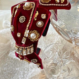 Ornate red velvet Blair Headband boasts exquisite details with pearls and metallic embellishments