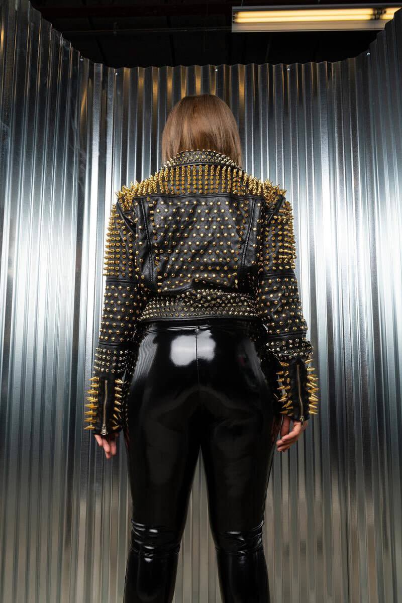 Person wearing The Lucifer Gold Studded Jacket with gold and silver metallic embellishments