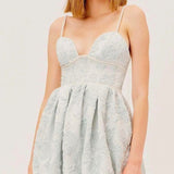 White lace mini dress with spaghetti straps and pleated skirt, Love & Lemons Lydia Party Dress