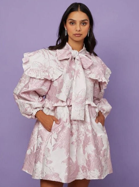 Frilly pale pink Misty Jacquard Bow Dress with puffed sleeves and bow collar