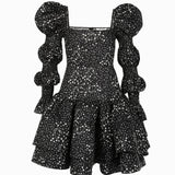 Sparkly black Beverly Hills dress with puffed sleeves and ruffled skirt for a night out