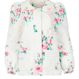 Floral-patterned white blouse with long sleeves from The Nursery House Coat collection