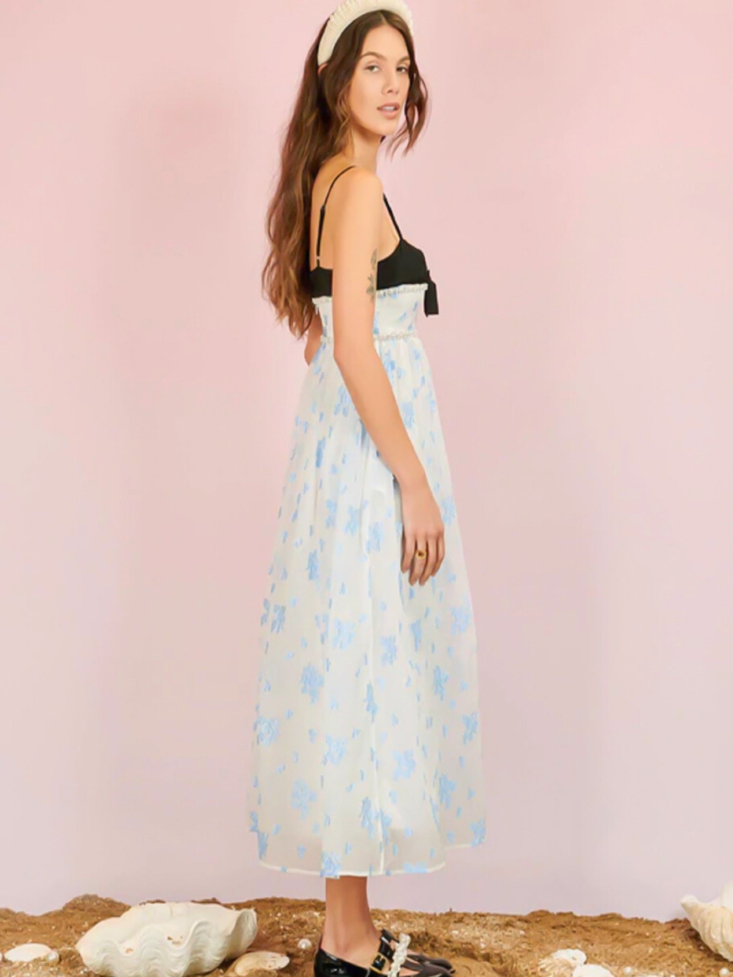 Woman in Ocean Blues Cami Midi Dress featuring a light blue floral design