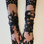 Hand sewn opera gloves in black lace elegantly covering hands and arms