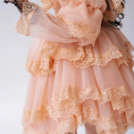 Close-up of tiered lace ruffles on the Midnight Symphony Organza Mini Dress highlighting delicate craftsmanship and soft pumpkin milk organza fabric.