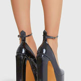 Extremely high black platforms with ankle straps perfect for a gown or grand bow sash