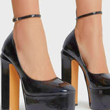 Glossy black platforms with thick ankle straps, perfect for a gown with a grand bow sash