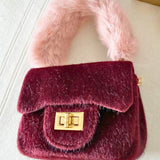 Burgundy Petit Agneau Micro Handbag with pink faux fur handle and gold clasp