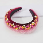 Handmade purple velvet headband with pink faux fur and jeweled embellishments, ideal for adding a regal touch to winter accessories.