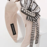 Beige Queenship Cotton Headband with crown embellishment and rhinestone strands for gowns.