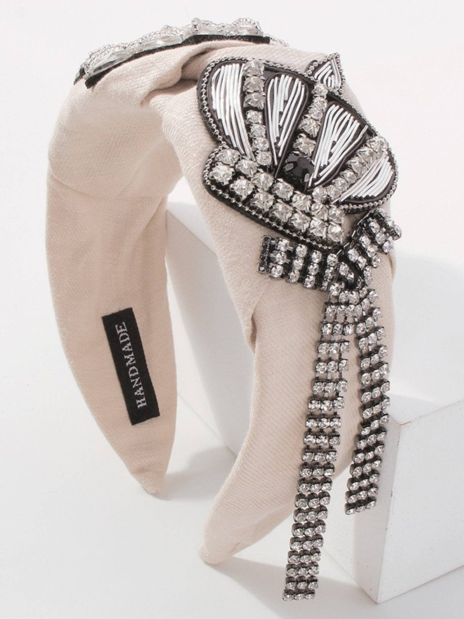 Beige Queenship Cotton Headband with crown embellishment and rhinestone strands for gowns.
