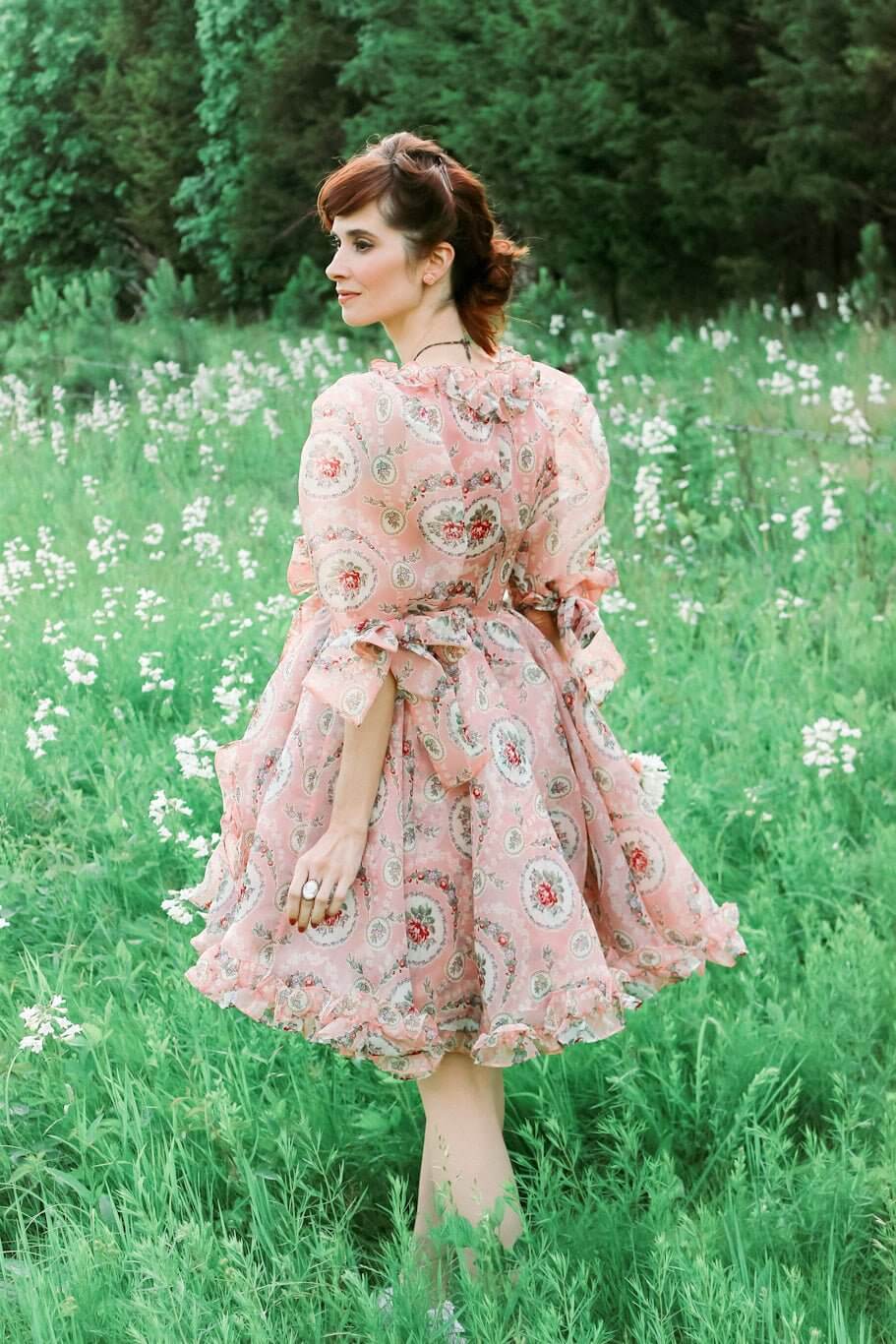 Floral pink Rapunzel Organza Marie Dress featuring a full skirt and long sleeves