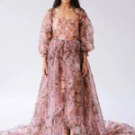 Front view of the Ode to Jove Twilight Reverie Ball Gown with square neckline, bishop sleeves, and flowing high-low hemline.