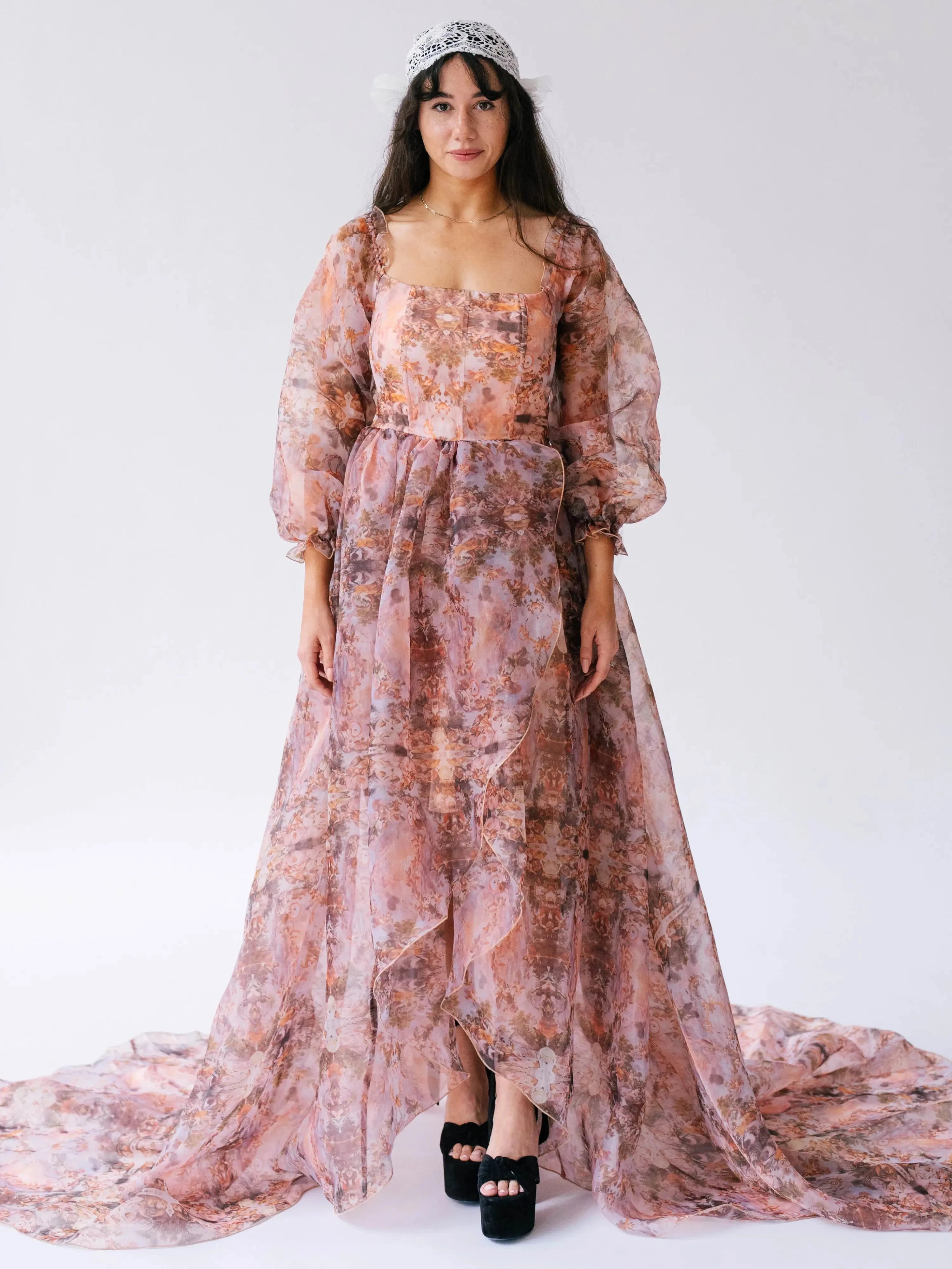 Front view of the Ode to Jove Twilight Reverie Ball Gown with square neckline, bishop sleeves, and flowing high-low hemline.