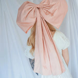 Back view of the Baby Antoinette Pink Hair Bow showing its 25-inch length and structured silk taffeta design in soft pink.