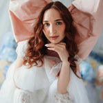 Baby Antoinette Silk Hair Bow styled with a white lace dress, featuring oversized silk taffeta design for coquette fashion lovers.