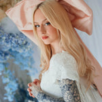 Side view of the Baby Antoinette Silk Hair Bow with flowing tails, styled with long blonde hair and a lace dress for a romantic finish.
