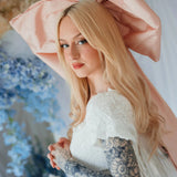 Side view of the Baby Antoinette Silk Hair Bow with flowing tails, styled with long blonde hair and a lace dress for a romantic finish.