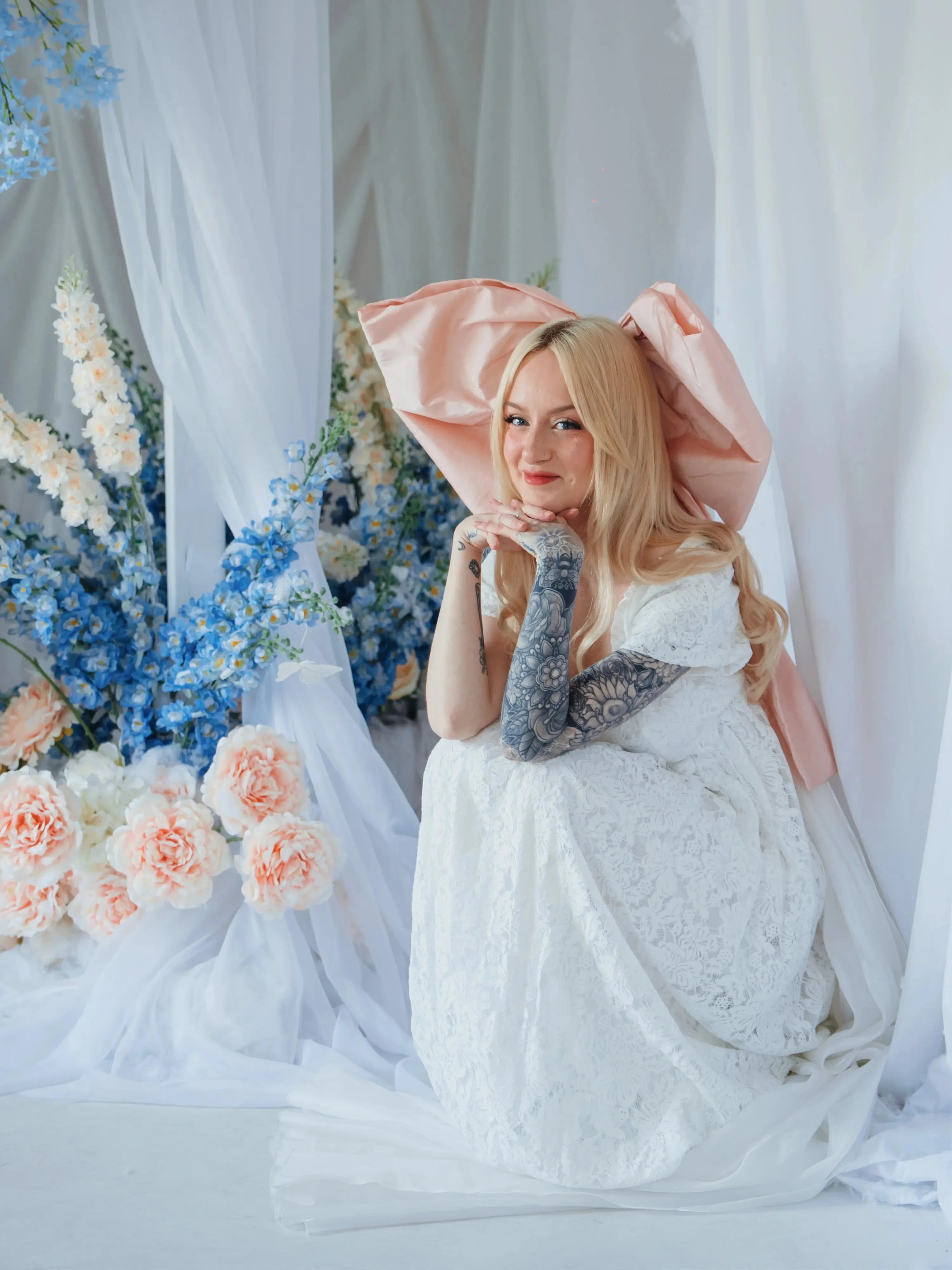 The Baby Antoinette Silk Hair Bow worn with a vintage-inspired lace gown, highlighting its voluminous silk taffeta and romantic appeal.