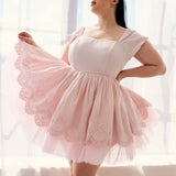 Soft pink tulle dress with fitted bodice and flared skirt from The Soft Pink Blossom Dress