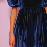 Navy blue velvet mini dress with puffed sleeves and gathered skirt from Spell Velvet