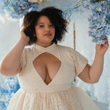 Close-up of plus-size model in The Victorian Lace Tea Party Mini Dress with diamond keyhole bust and floral lace texture.