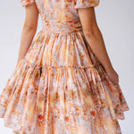 Midi day dress with puff sleeves and a tiered, gathered skirt.