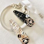 Decorative Tweed Peony Hair Clips with floral designs and rhinestone accents.