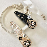 Decorative Tweed Peony Hair Clips with floral designs and rhinestone accents.