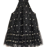 Black halter neck mini dress with white stars and tulle skirt, perfect for twirling