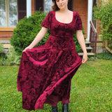 Deep burgundy Velvet Viola Dress featuring a flowing skirt and short sleeves