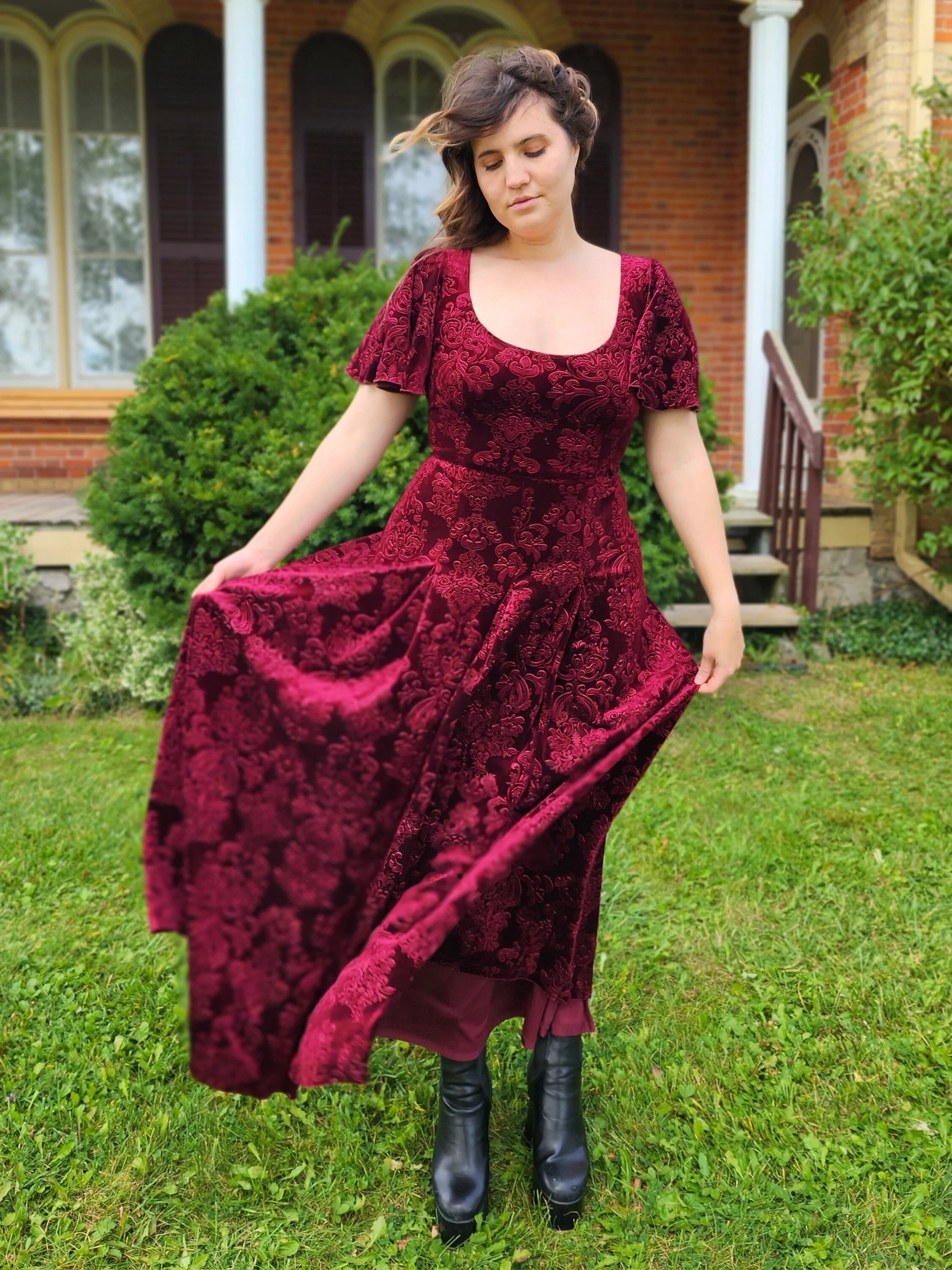 Deep burgundy Velvet Viola Dress featuring a flowing skirt and short sleeves