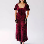 The Scarlet Red Velvet Viola Dress with butterfly sleeves and Victorian pattern, styled with black hat and gloves. 