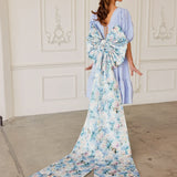 Elegant floral print gown featuring a grand bow sash and graceful train