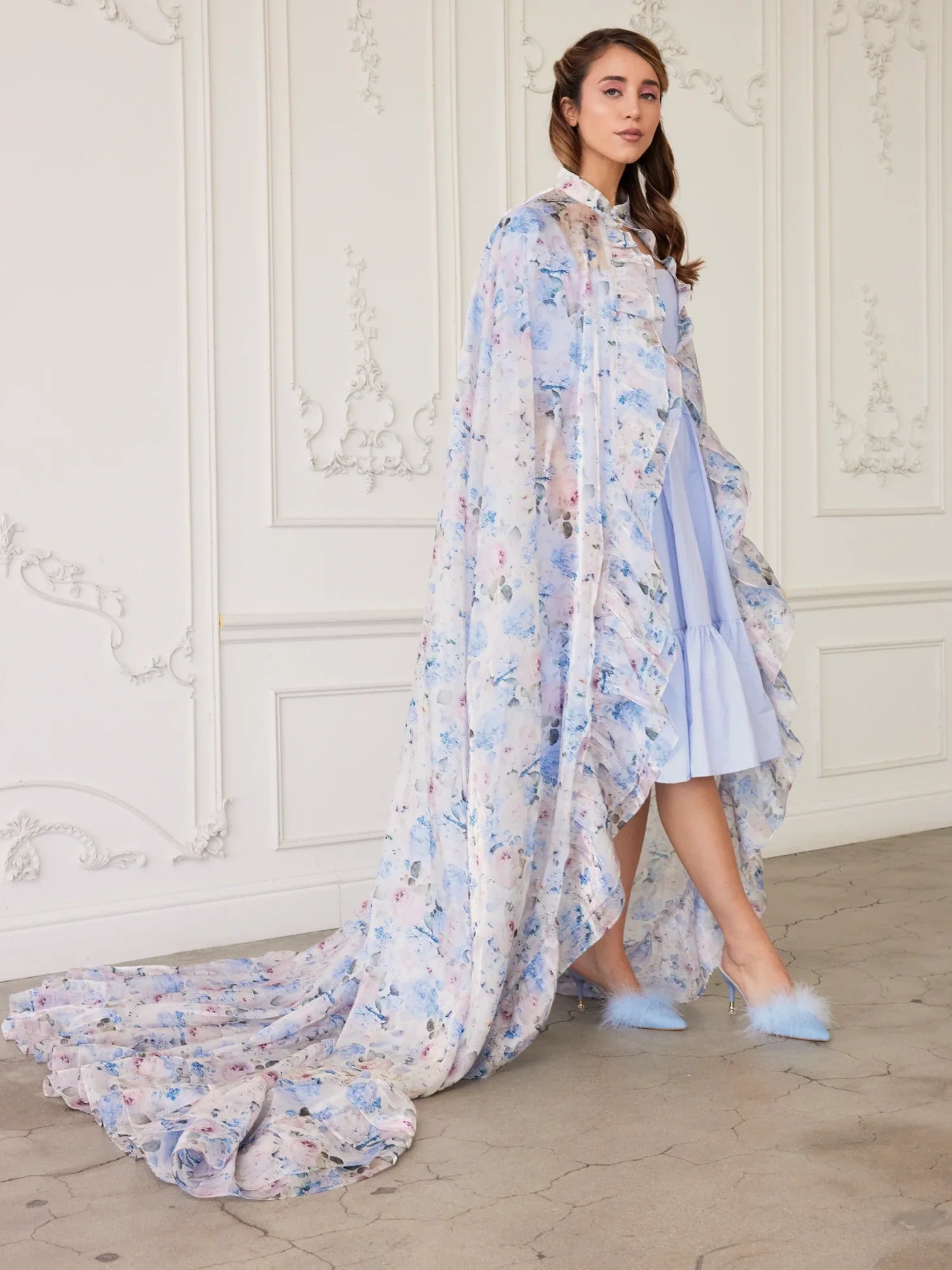 Flowing Wild Bloom Priestess Cape over a light blue dress with a long train