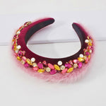 Ornate burgundy Winter Magic Headband with colorful beads and pink feathers