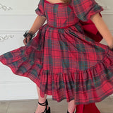 Red and gray plaid Winter Tartan Josephine Midi Dress with a full skirt and grand bow sash