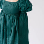 Close-up view of the woodland bell sleeve dress.